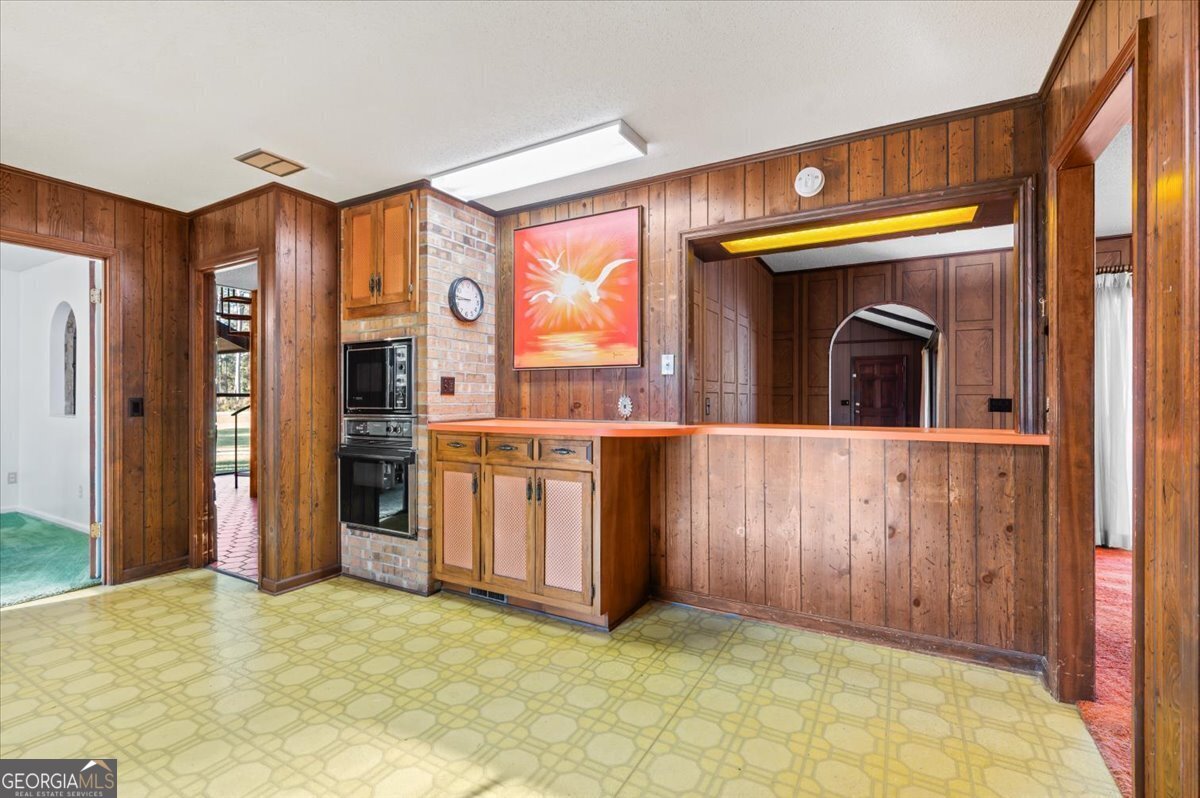 2066 Cherokee Street Waycross, GA 31503 - Photo 21 of 56 a view of a kitchen with stainless steel appliances granite countertop a refrigerator and a sink