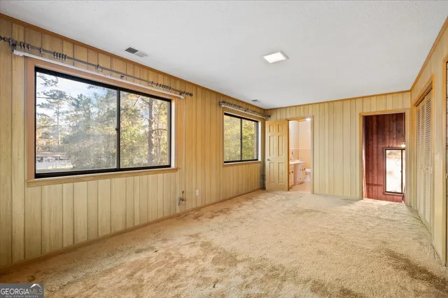 a view of a house with a large trees