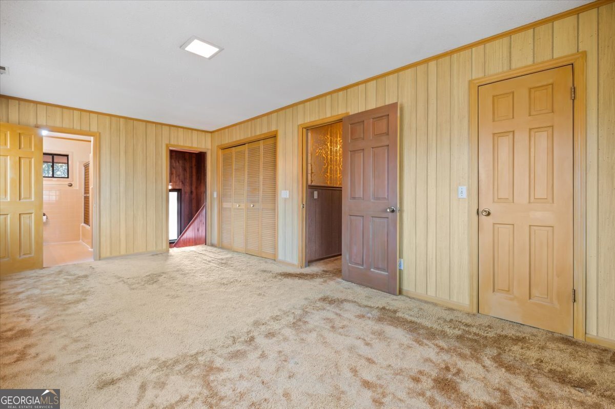 2066 Cherokee Street Waycross, GA 31503 - Photo 44 of 56 an empty room with closet and a bathroom