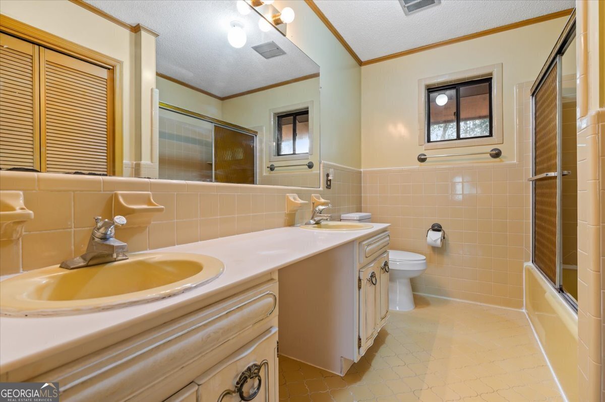 2066 Cherokee Street Waycross, GA 31503 - Photo 45 of 56 a bathroom with a sink and a mirror