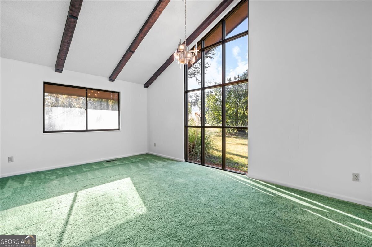 2066 Cherokee Street Waycross, GA 31503 - Photo 9 of 56 an empty room with windows