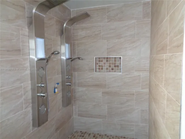 a bathroom with a sink vanity and a mirror