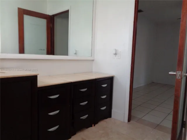 a view of a street with a palm tree