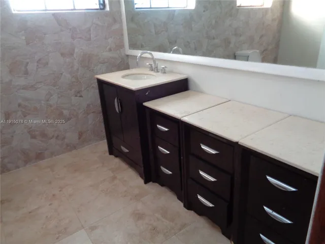 a view of a chair and table in the garden