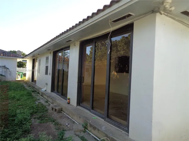 a view of a glass door of the house
