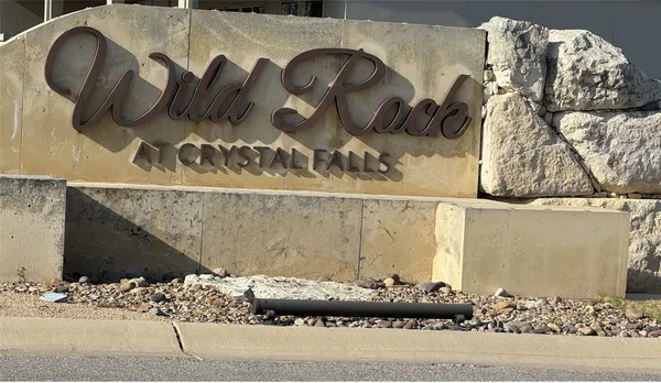 a view of a car parked in front of a building