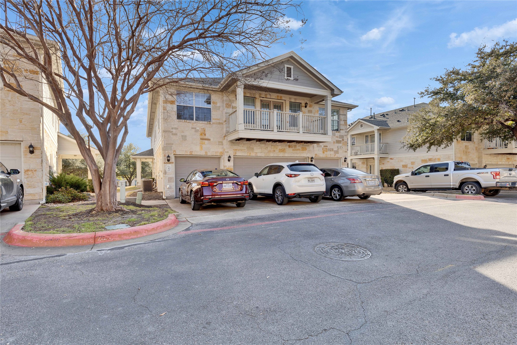 1900 Scofield Ridge Parkway, Unit 2701 Austin, TX 78727 - Photo 20 of 20 a view of a cars park in front of a brick house