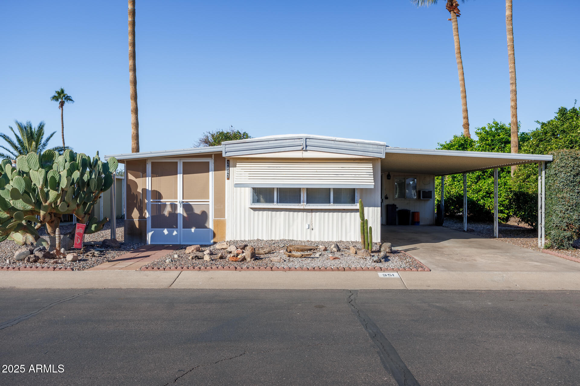 a view of a house with a street