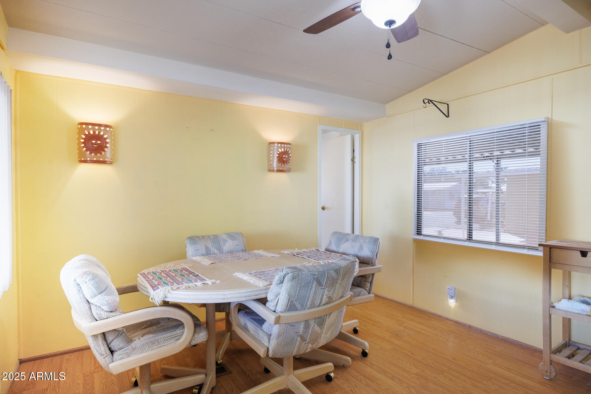 2100 North Trekell Road, Unit 351 Casa Grande, AZ 85122 - Photo 17 of 31 a view of a dining room with furniture and wooden floor