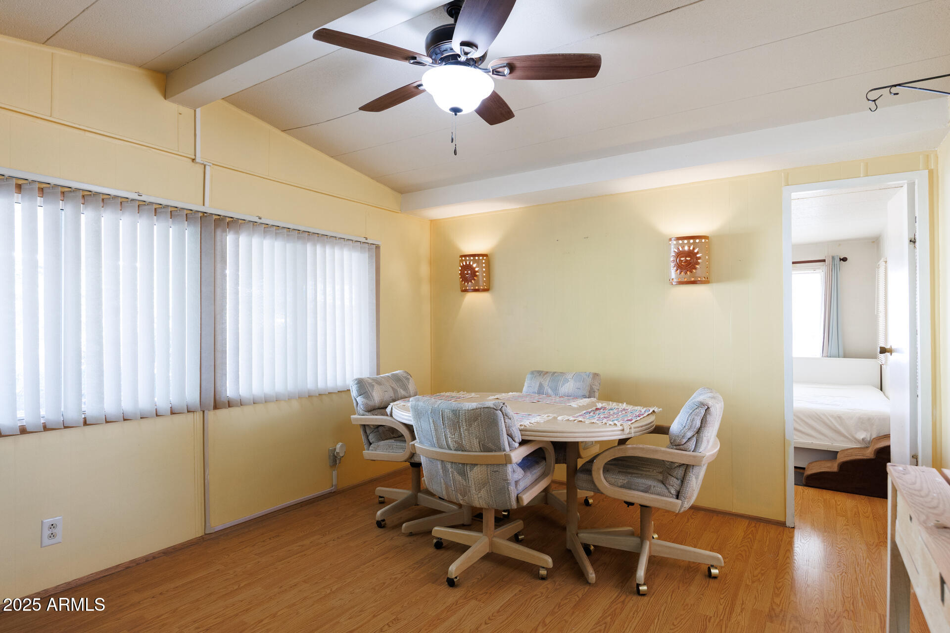 2100 North Trekell Road, Unit 351 Casa Grande, AZ 85122 - Photo 18 of 31 a view of a dining room with furniture and wooden floor