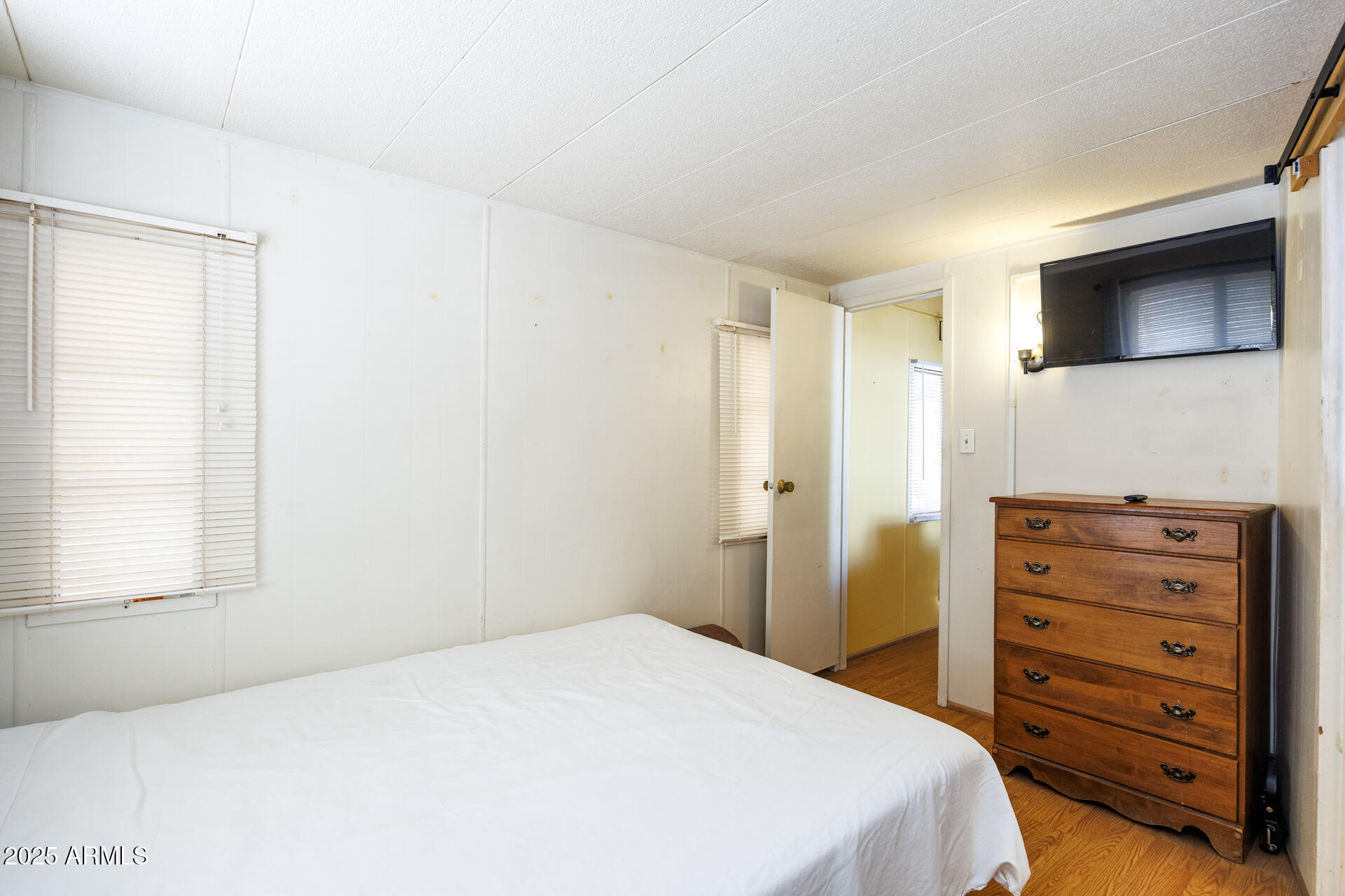 2100 North Trekell Road, Unit 351 Casa Grande, AZ 85122 - Photo 19 of 31 a bedroom with a bed and a television