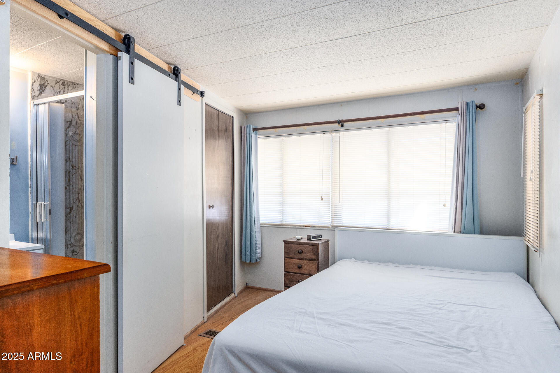 2100 North Trekell Road, Unit 351 Casa Grande, AZ 85122 - Photo 20 of 31 a bedroom with a bed and a window