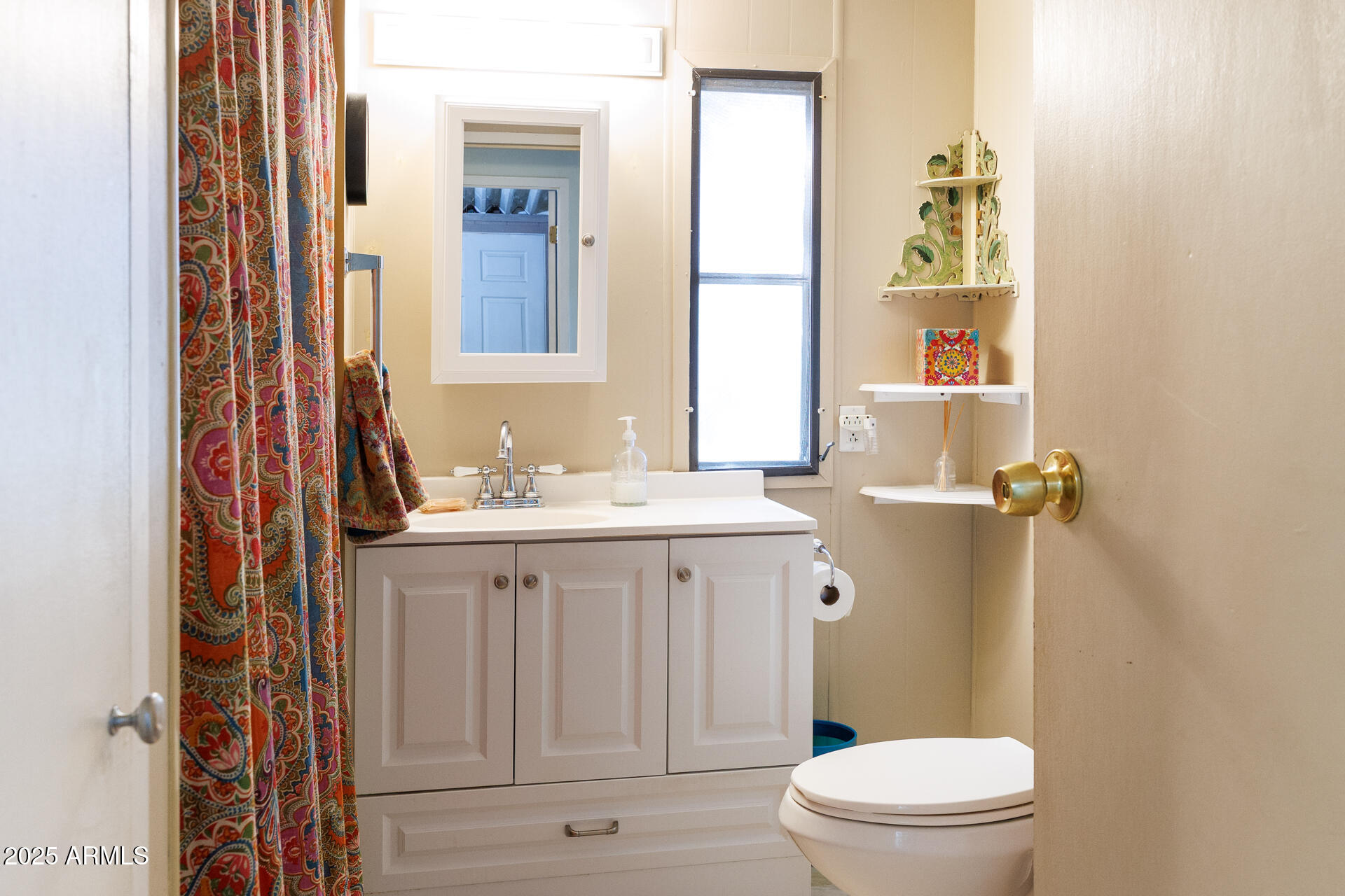 2100 North Trekell Road, Unit 351 Casa Grande, AZ 85122 - Photo 25 of 31 a bathroom with a sink a toilet a mirror and shower
