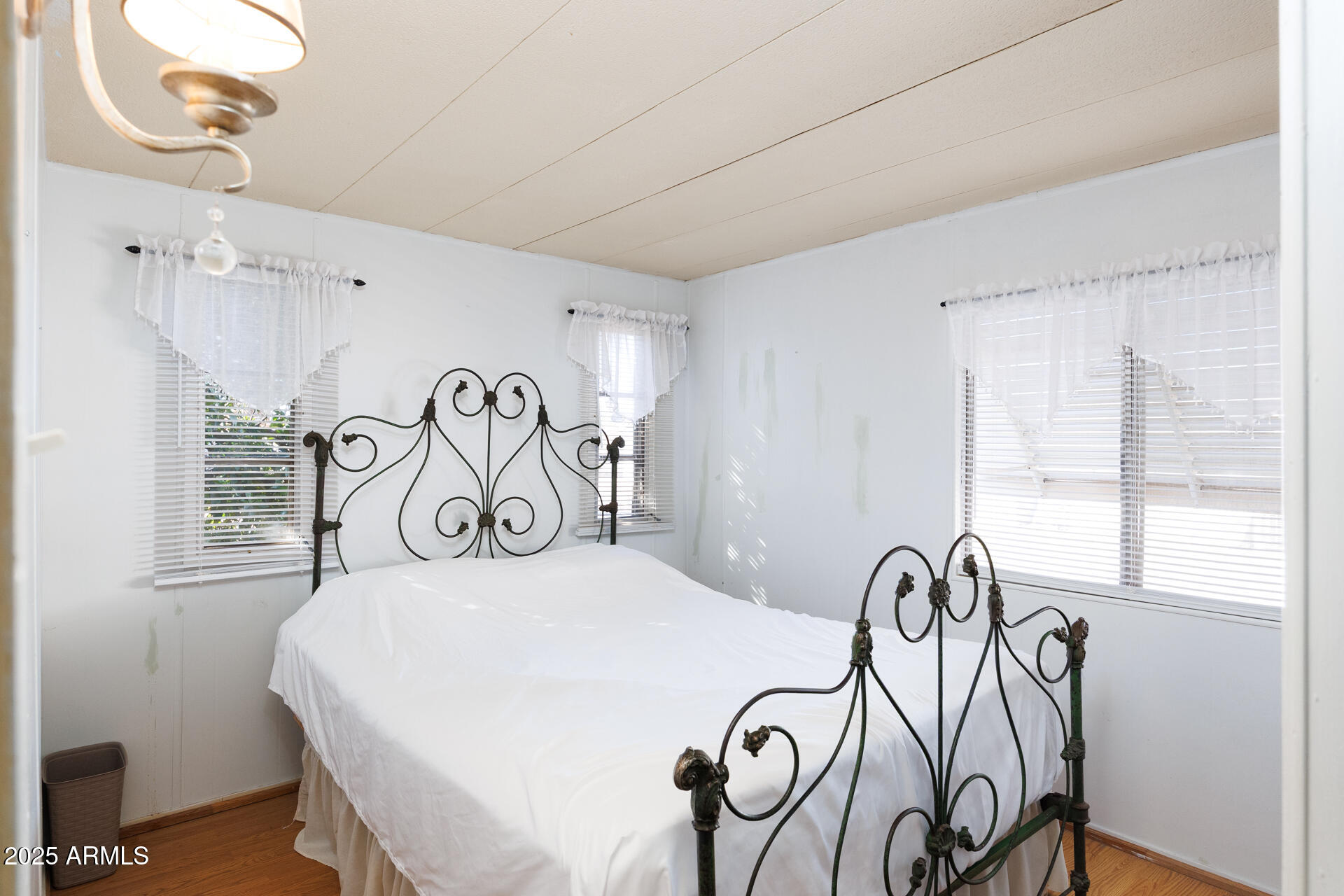 2100 North Trekell Road, Unit 351 Casa Grande, AZ 85122 - Photo 27 of 31 a bedroom with a bed and a table with chair