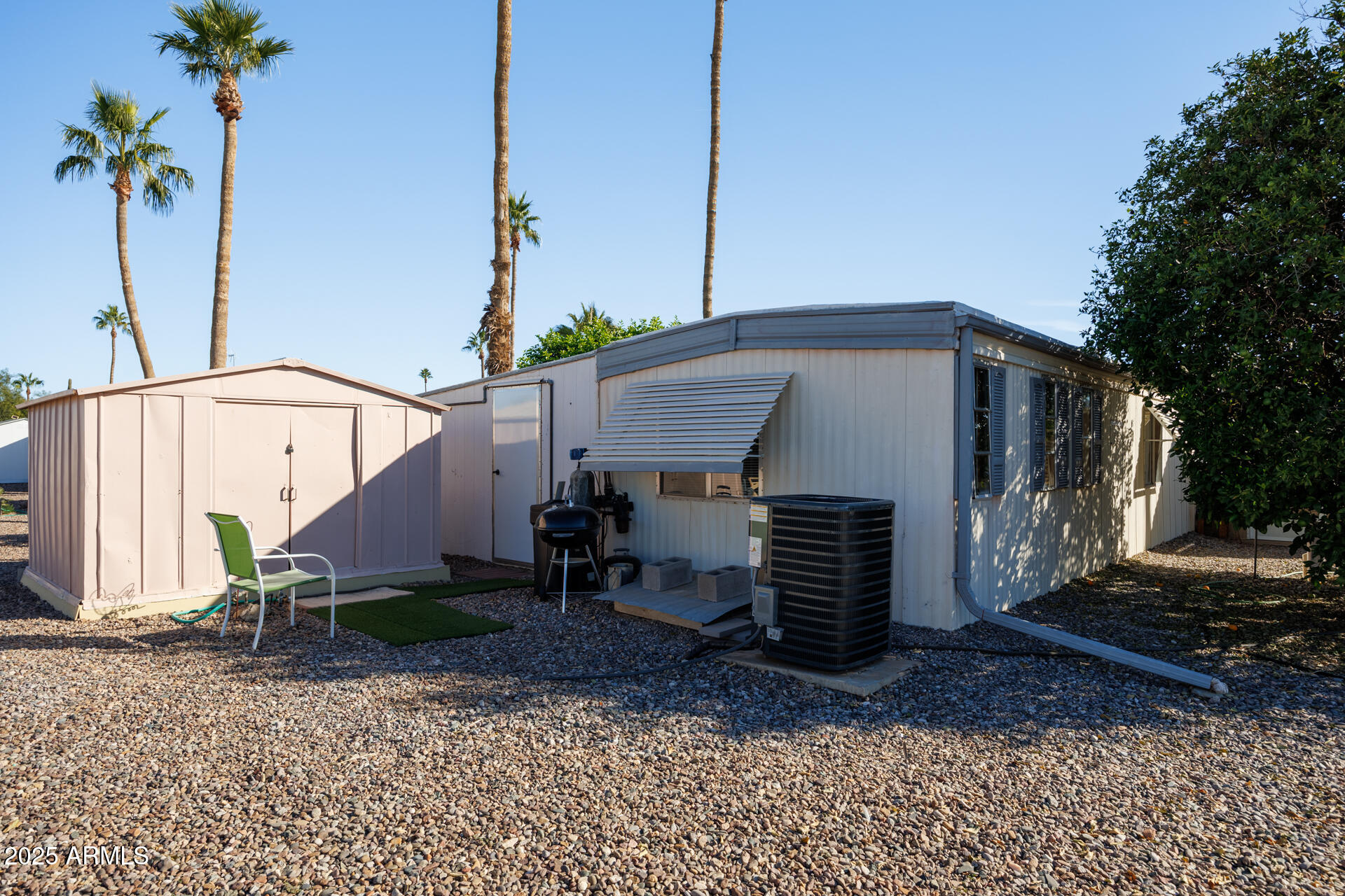 2100 North Trekell Road, Unit 351 Casa Grande, AZ 85122 - Photo 31 of 31 a view of a house with backyard and plants