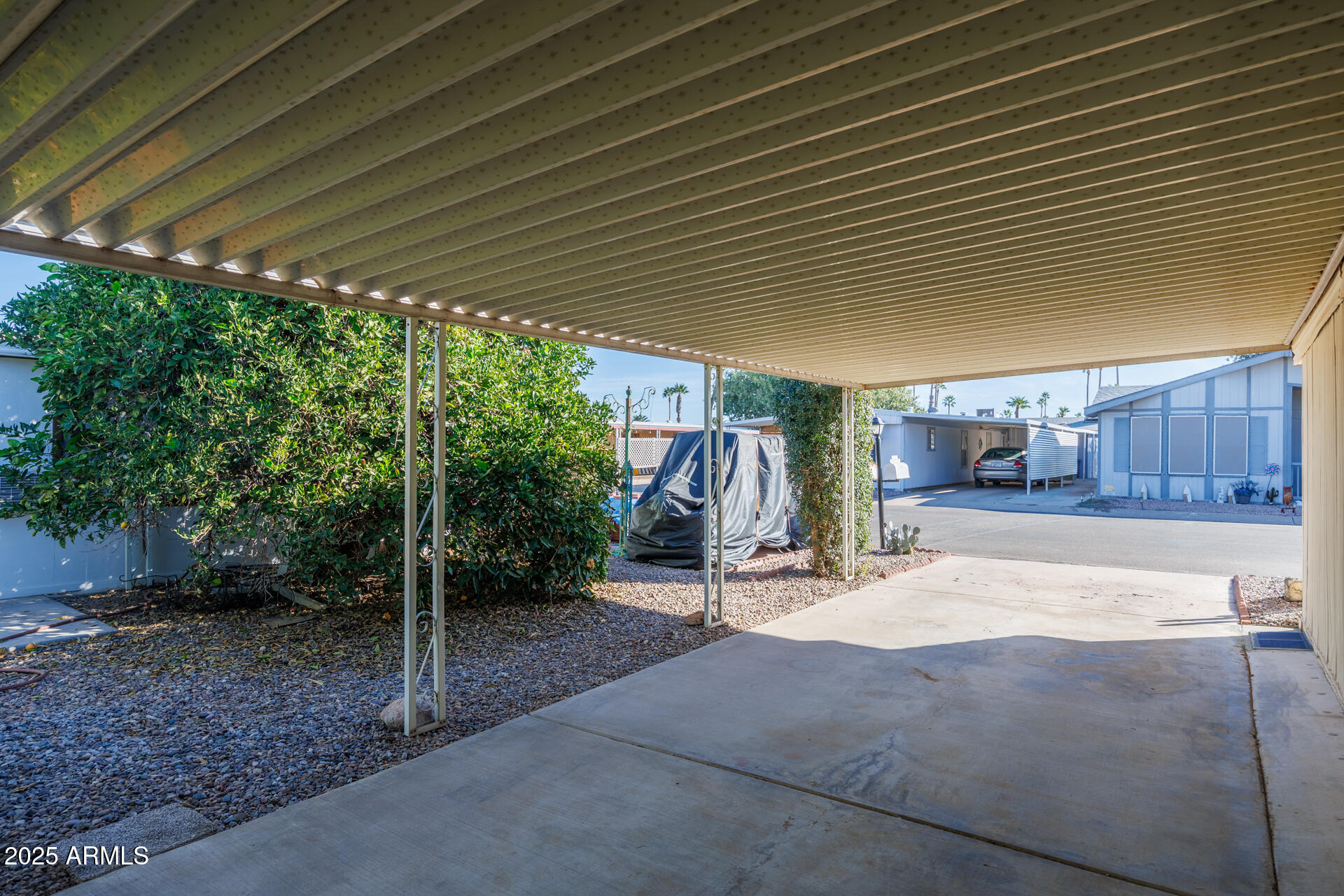 2100 North Trekell Road, Unit 351 Casa Grande, AZ 85122 - Photo 4 of 31 a patio with a table and chairs and a barbeque