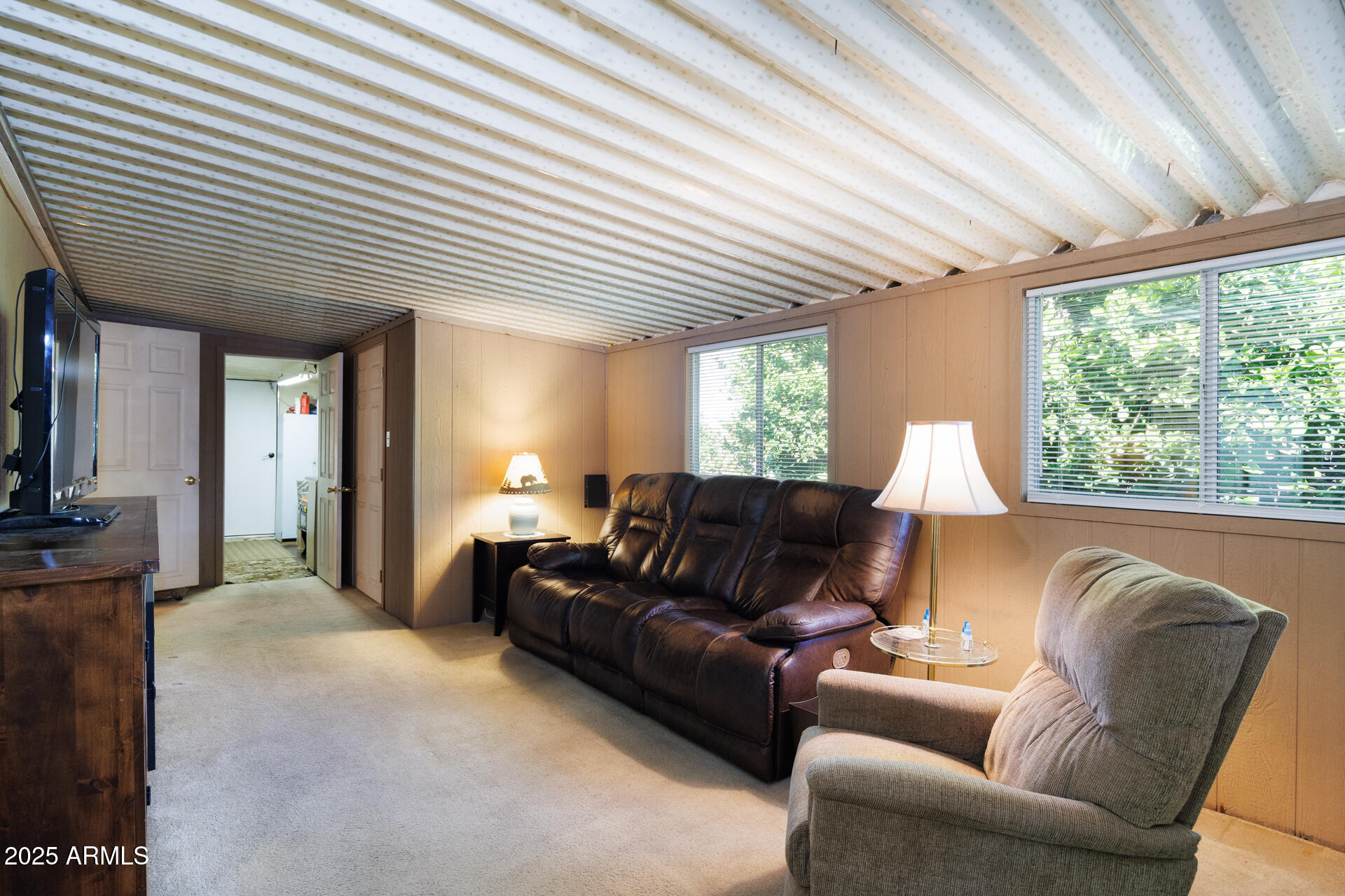 2100 North Trekell Road, Unit 351 Casa Grande, AZ 85122 - Photo 9 of 31 a living room with furniture wooden floor and a large window