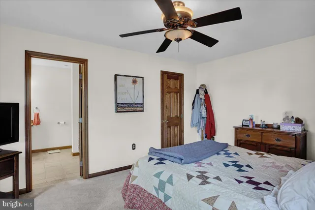 a bedroom with a bed and cabinets