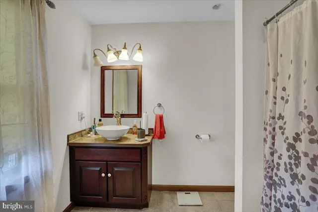 a bed room with a bed and a chandelier