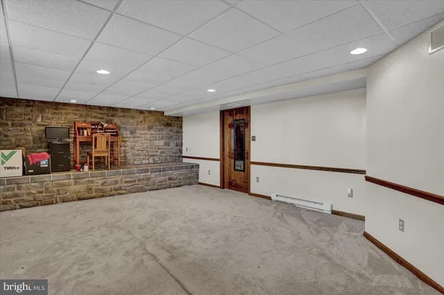 a view of an empty room with stairs