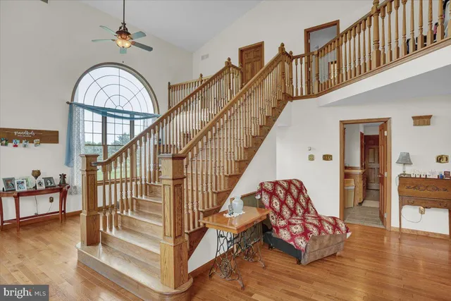 a view of entryway dining room and hall with wooden floor