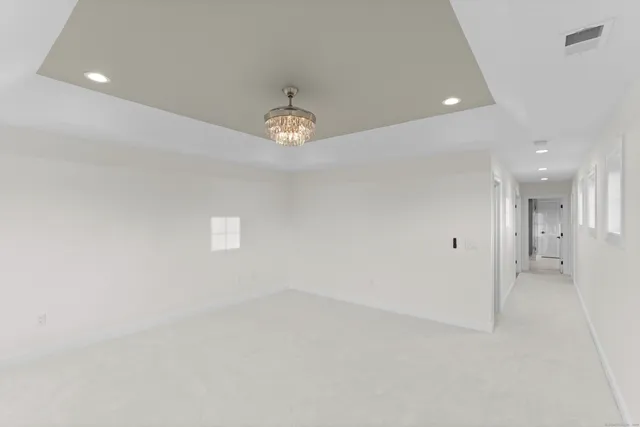 a bathroom with a granite countertop sink mirror and shower
