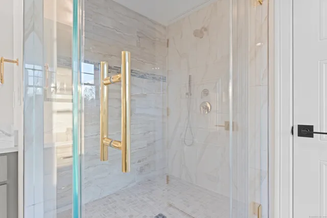 a bathroom with a bathtub and a shower