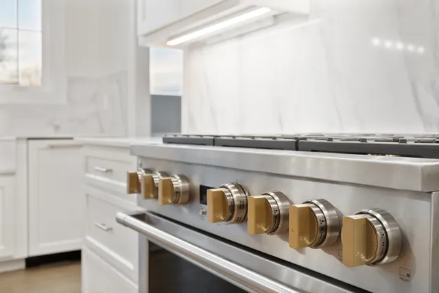 a close up of a stove sitting in a kitchen