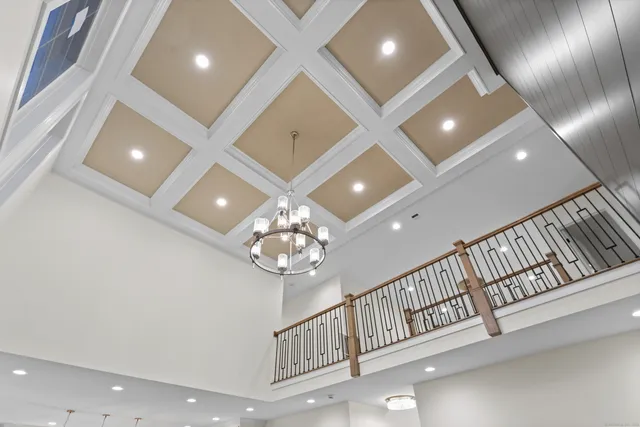 a bathroom with a light fixture and a fireplace