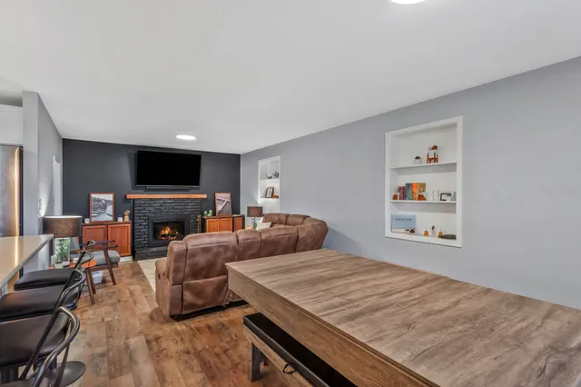 a bedroom with furniture and a flat screen tv
