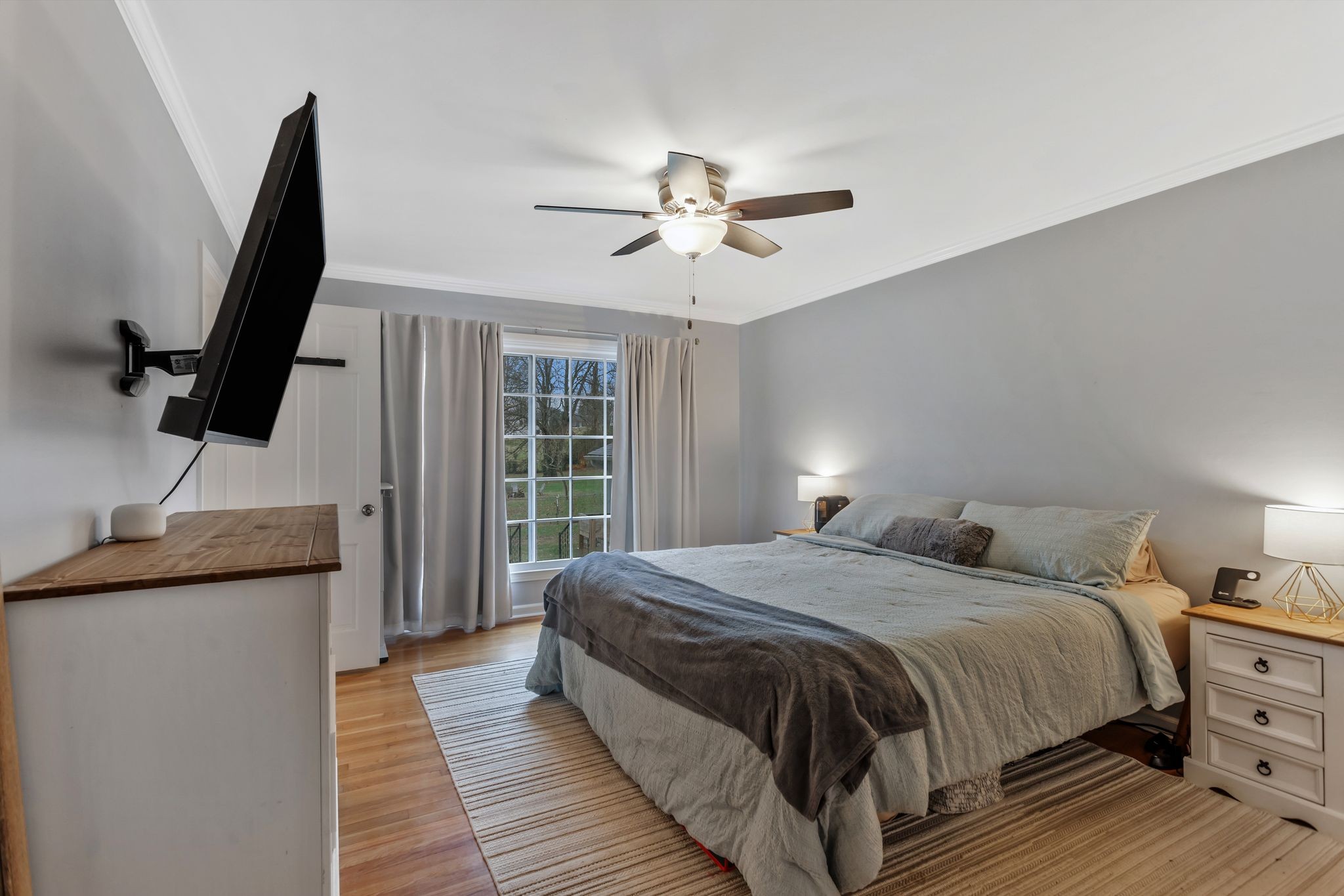 124 North Laurel Circle Columbia, TN 38401 - Photo 20 of 40 a bedroom with a bed and a flat tv screen on the dresser