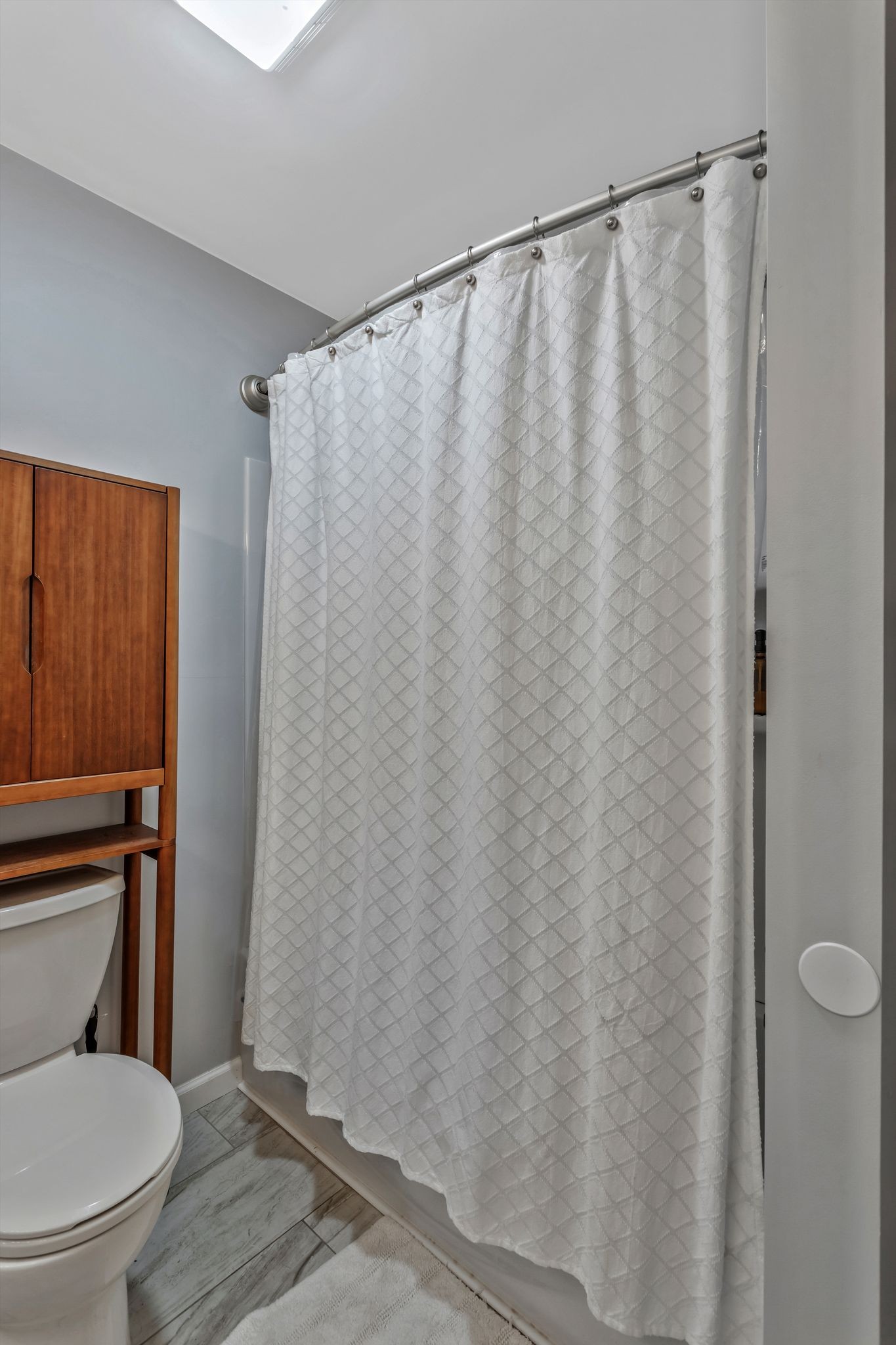 124 North Laurel Circle Columbia, TN 38401 - Photo 28 of 40 a white toilet sitting next to a shower curtain