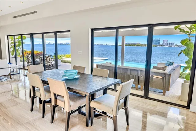 an aerial view of a city with lots of residential buildings ocean and ocean view