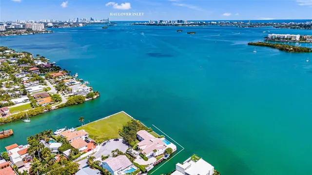 a living room with furniture large windows and a flat screen tv