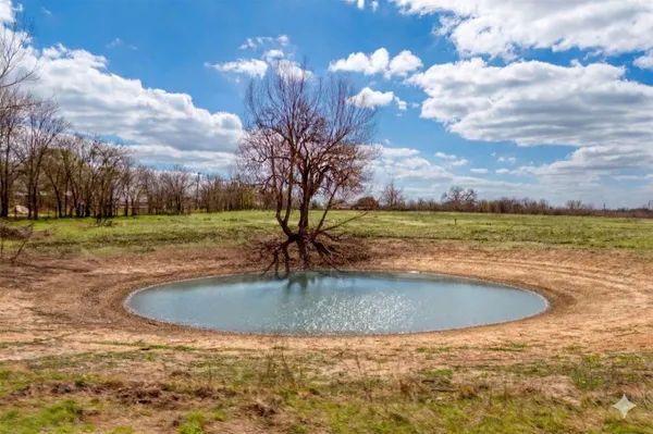 a view of a swimming pool with a yard