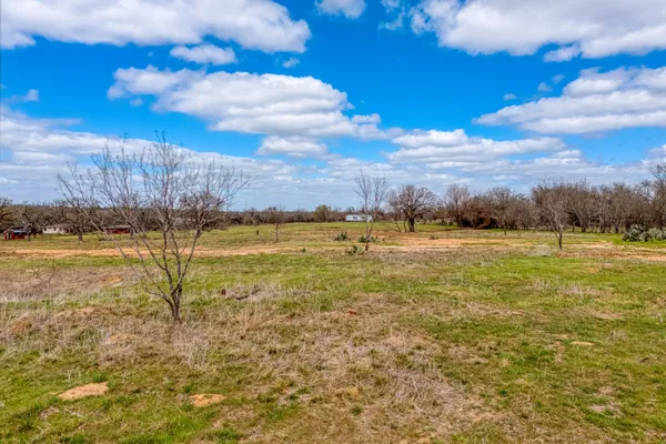a view of a lake with houses in the back