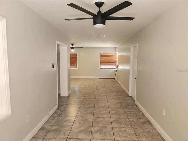 a view of a hallway with a chandelier