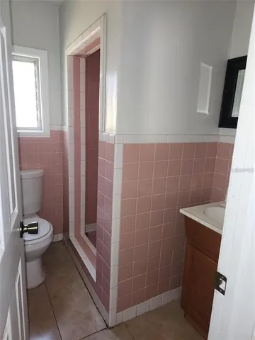 a bathroom with a sink and toilet