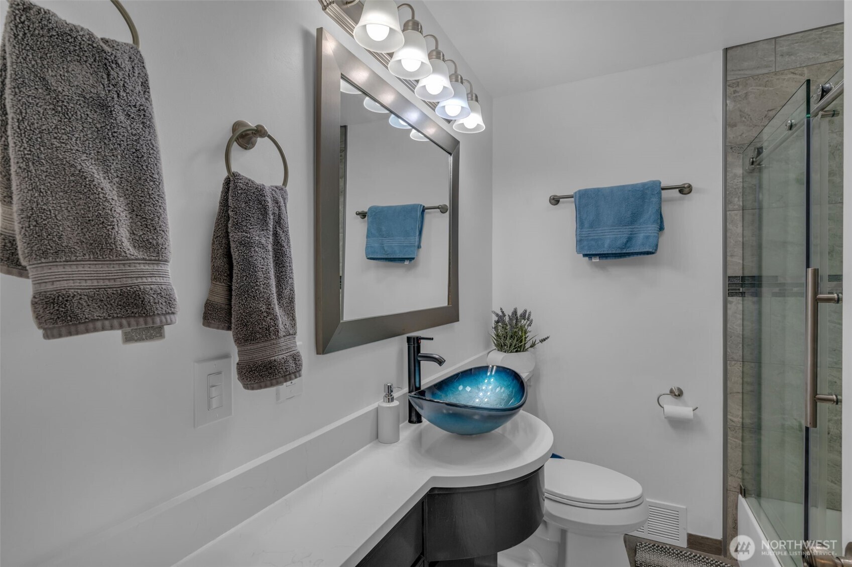 9015 218th Street Southwest Edmonds, WA 98026 - Photo 22 of 39 a bathroom with a toilet sink and mirror