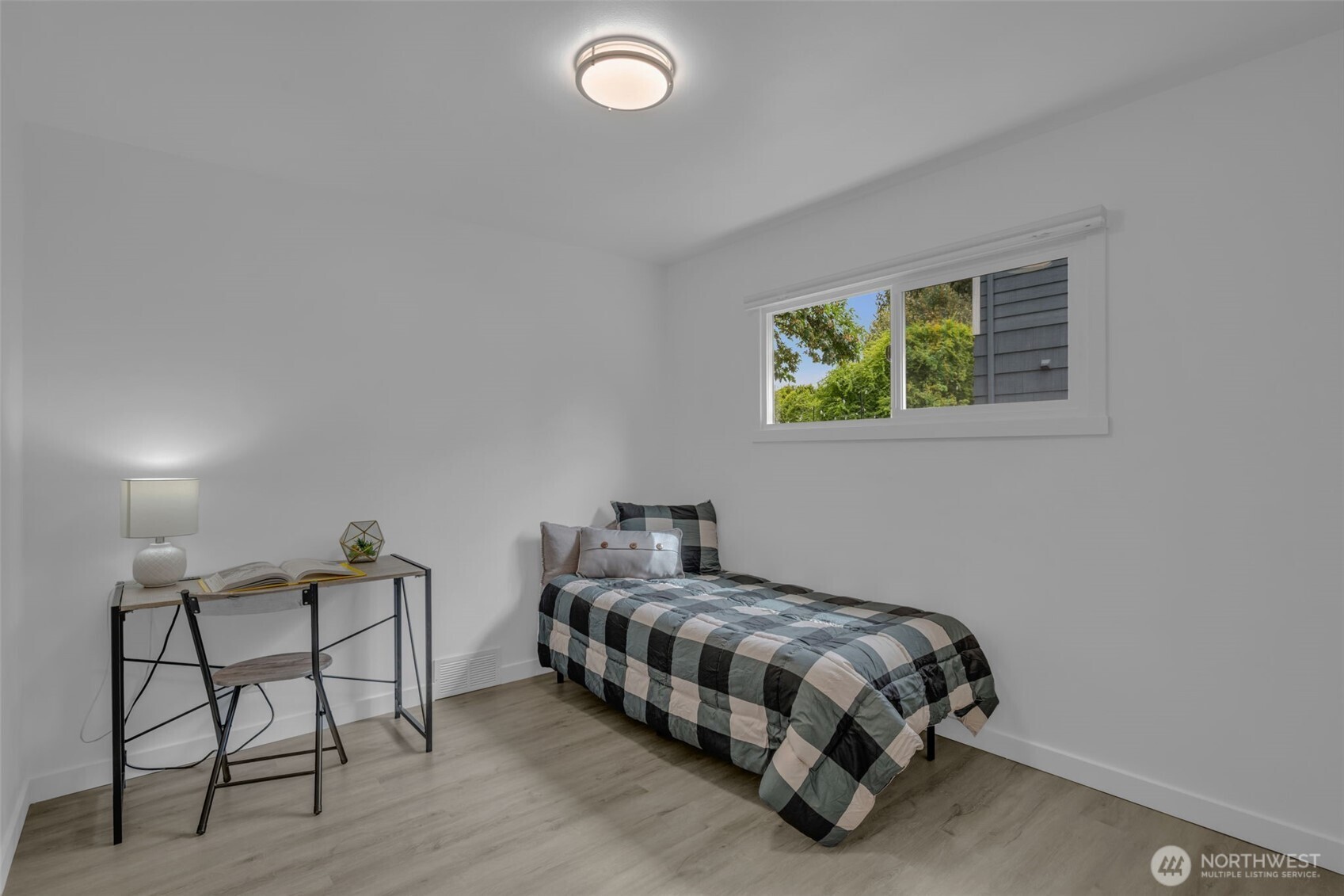 9015 218th Street Southwest Edmonds, WA 98026 - Photo 27 of 39 a bedroom with a bed and a painting on the wall