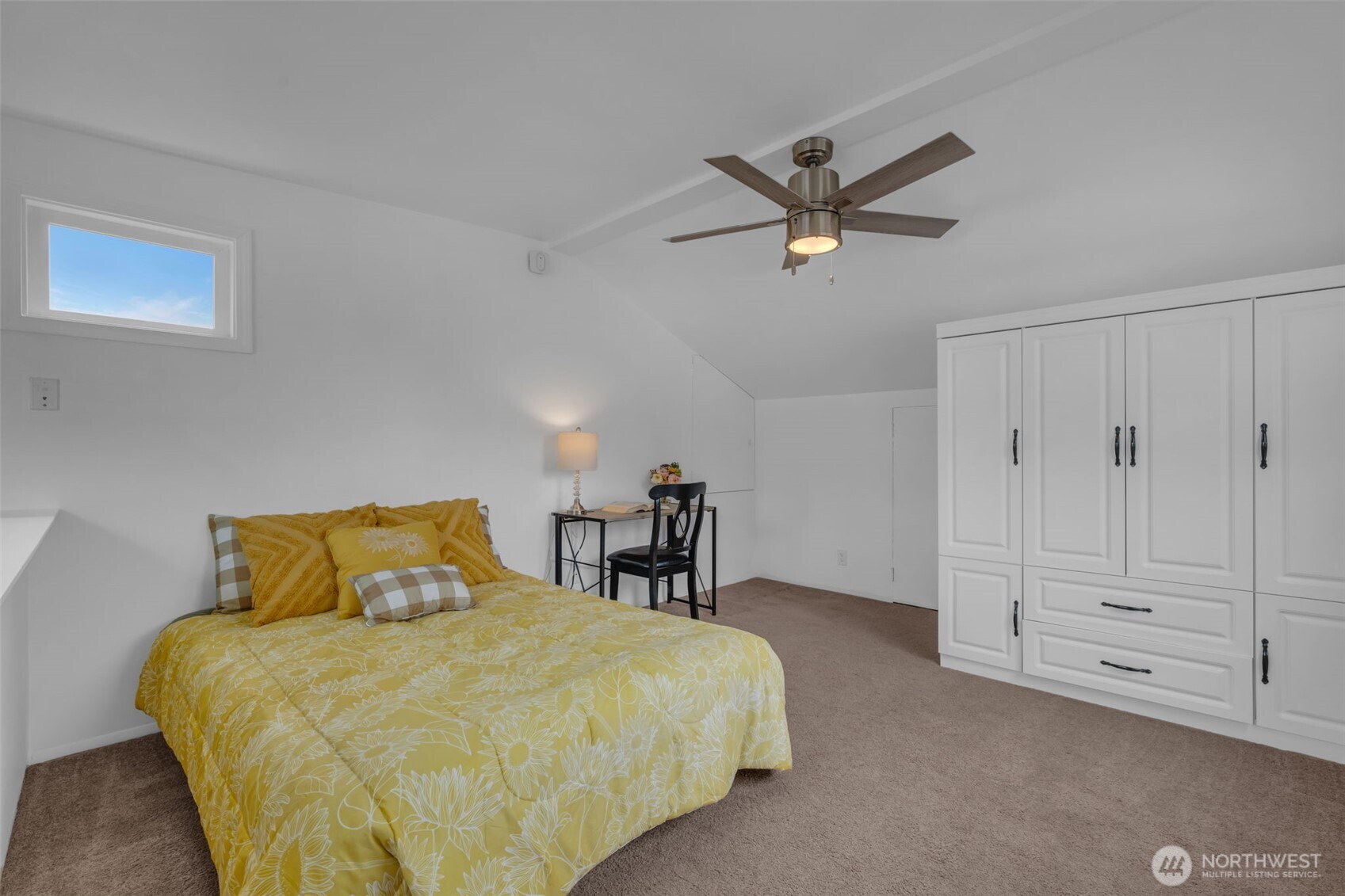 9015 218th Street Southwest Edmonds, WA 98026 - Photo 28 of 39 a bedroom with a bed and a chandelier