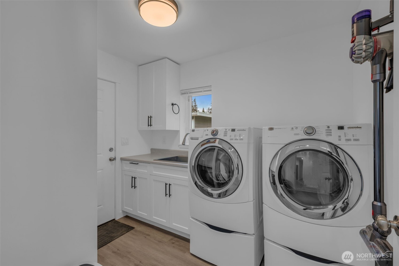 9015 218th Street Southwest Edmonds, WA 98026 - Photo 30 of 39 a utility room with sink dryer and washer