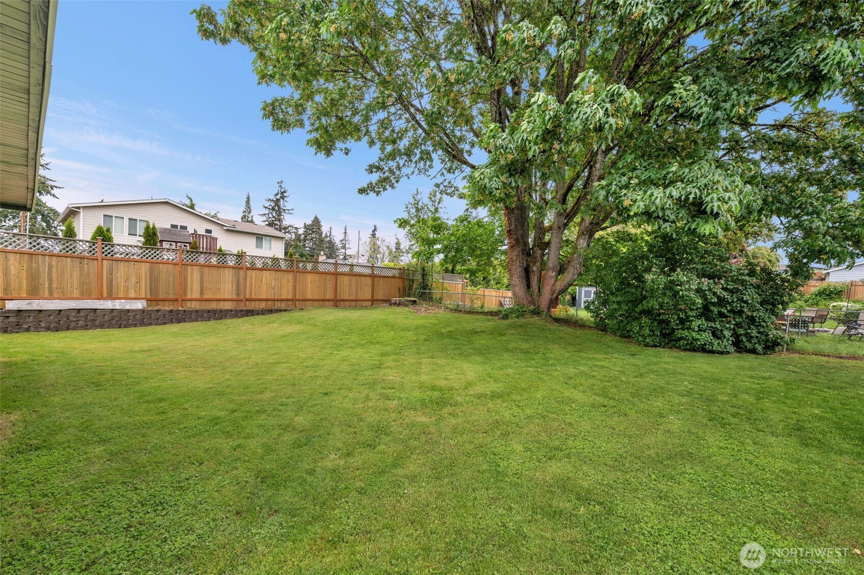 9015 218th Street Southwest Edmonds, WA 98026 - Photo 33 of 39 a view of a green field with wooden fence