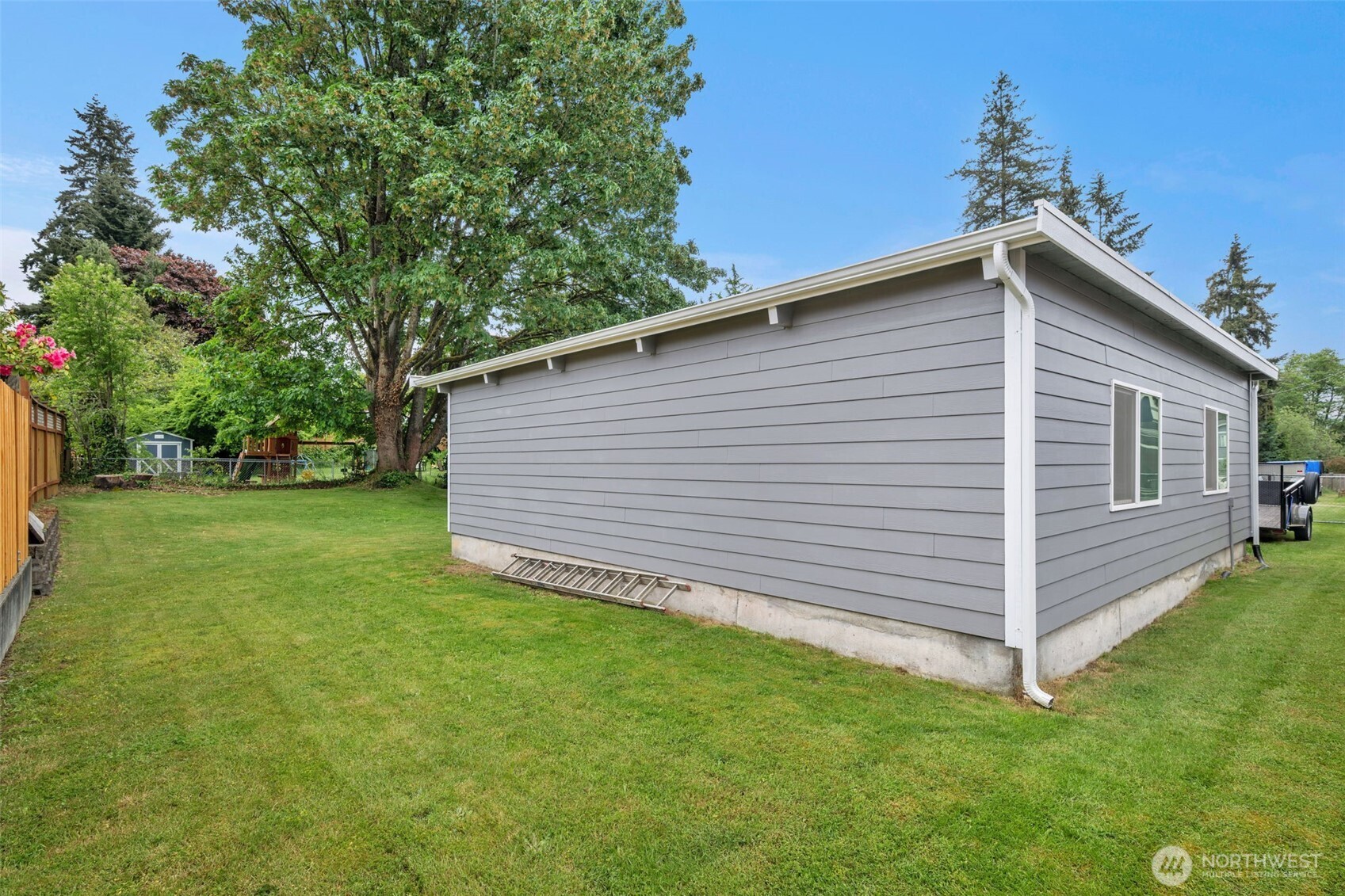 9015 218th Street Southwest Edmonds, WA 98026 - Photo 36 of 39 a view of a backyard with a garden