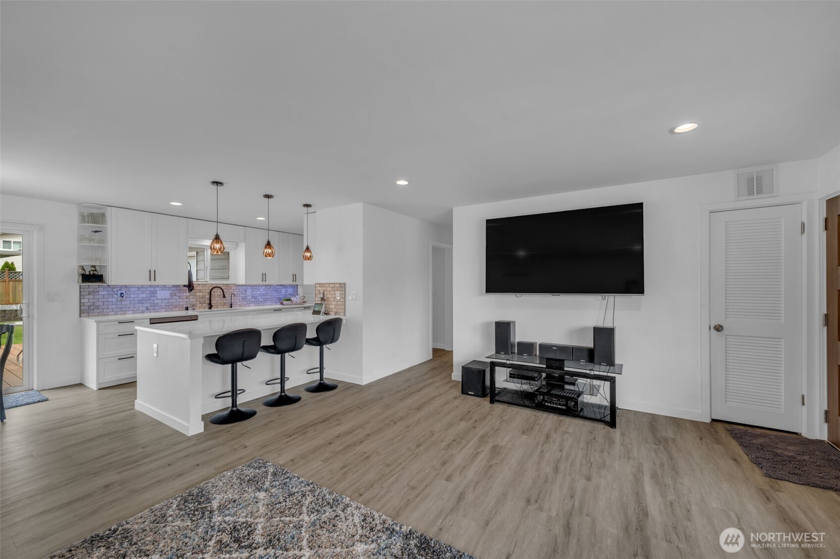 9015 218th Street Southwest Edmonds, WA 98026 - Photo 10 of 39 a living room with stainless steel appliances furniture and a flat screen tv