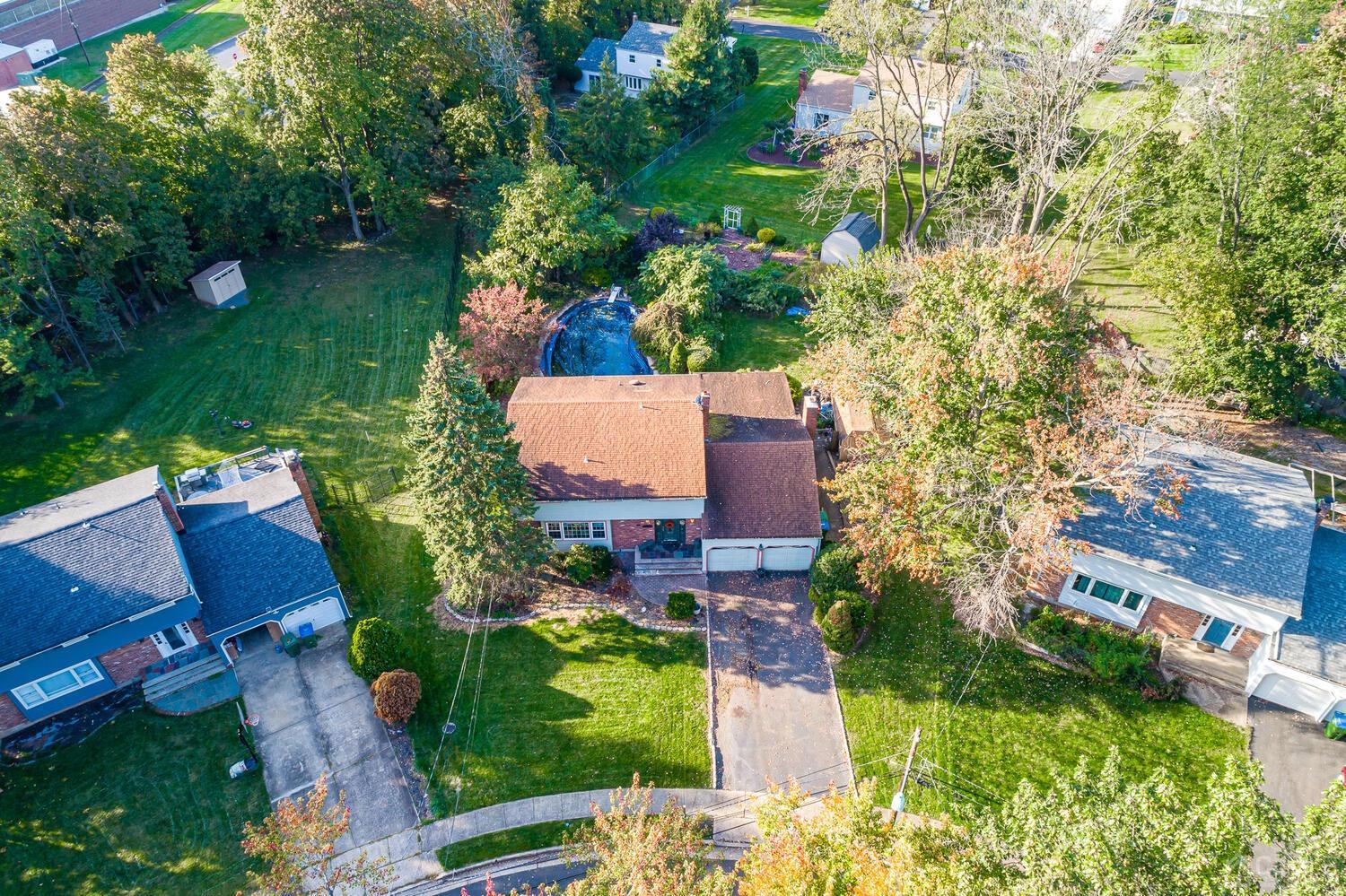 18 Dellview Drive Edison, NJ 08820 - Photo 3 of 5 an aerial view of a house with a garden and yard