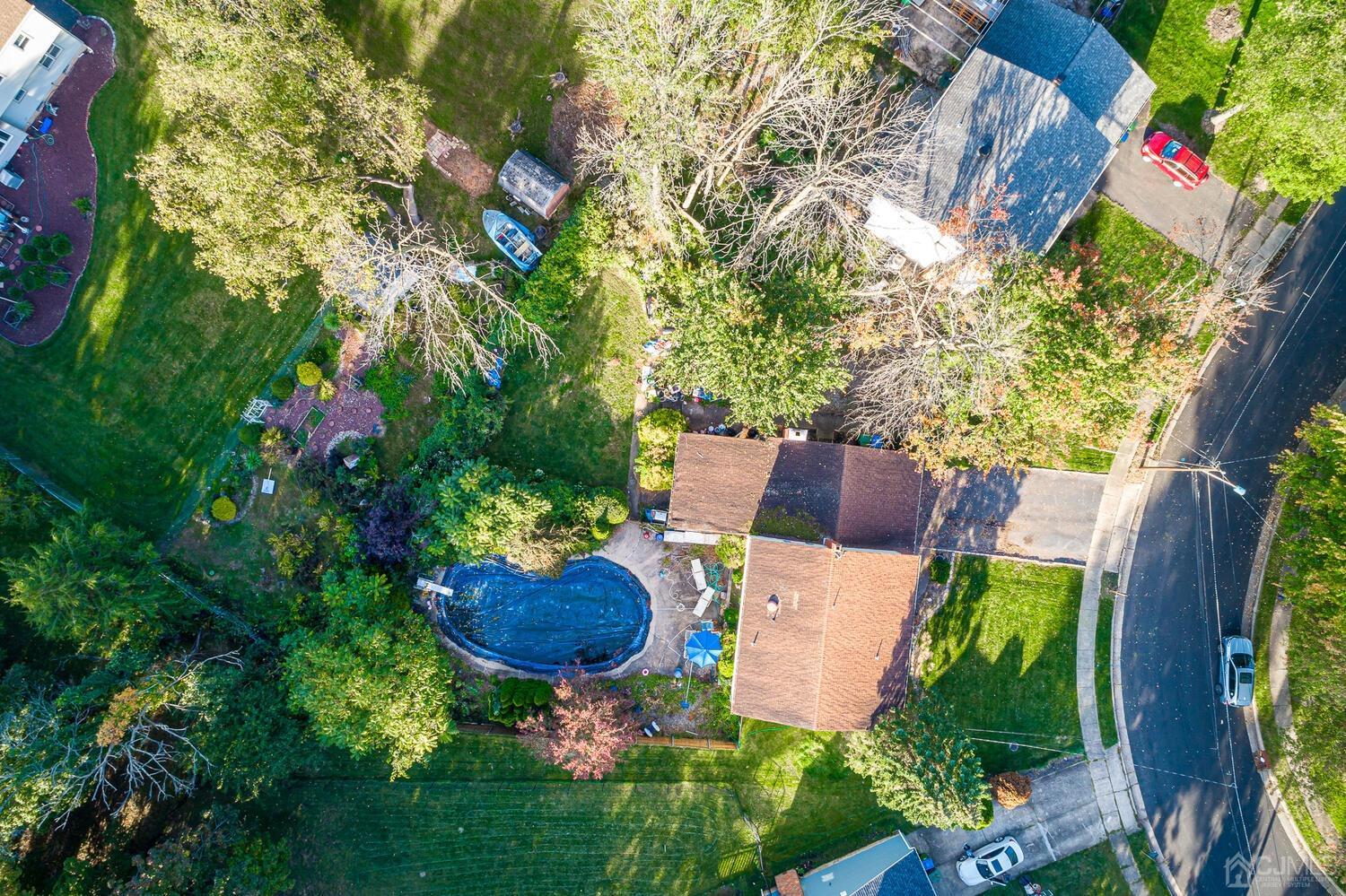 18 Dellview Drive Edison, NJ 08820 - Photo 4 of 5 an aerial view of a house with yard swimming pool and outdoor seating