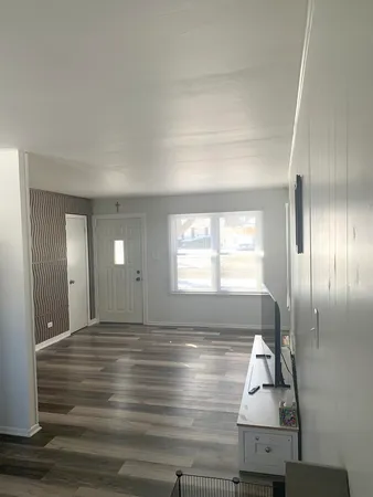 a view of an empty room and window