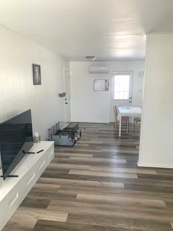a living room with fireplace furniture and a table