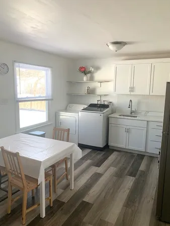 a kitchen that has a sink and a stove in it